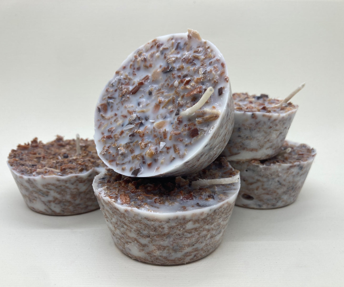 fire starters made from recycled wood shavings wax and essential oil decorated with orange and cinnamon