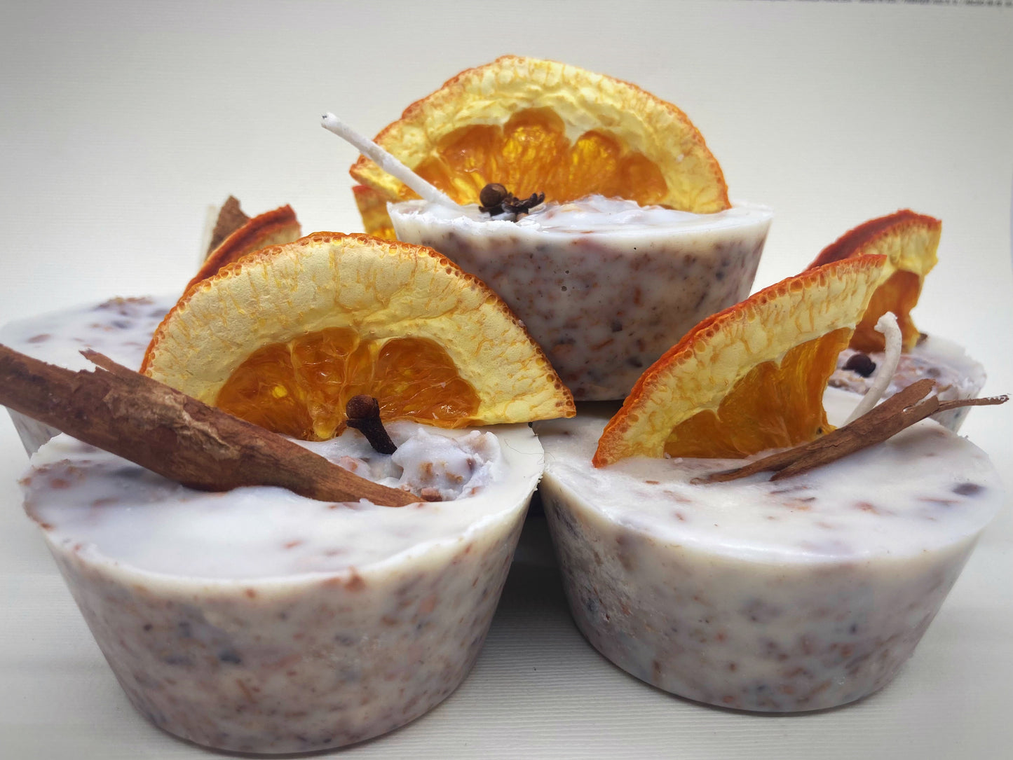 fire starters made from recycled wood shavings wax and essential oil decorated with orange and cinnamon