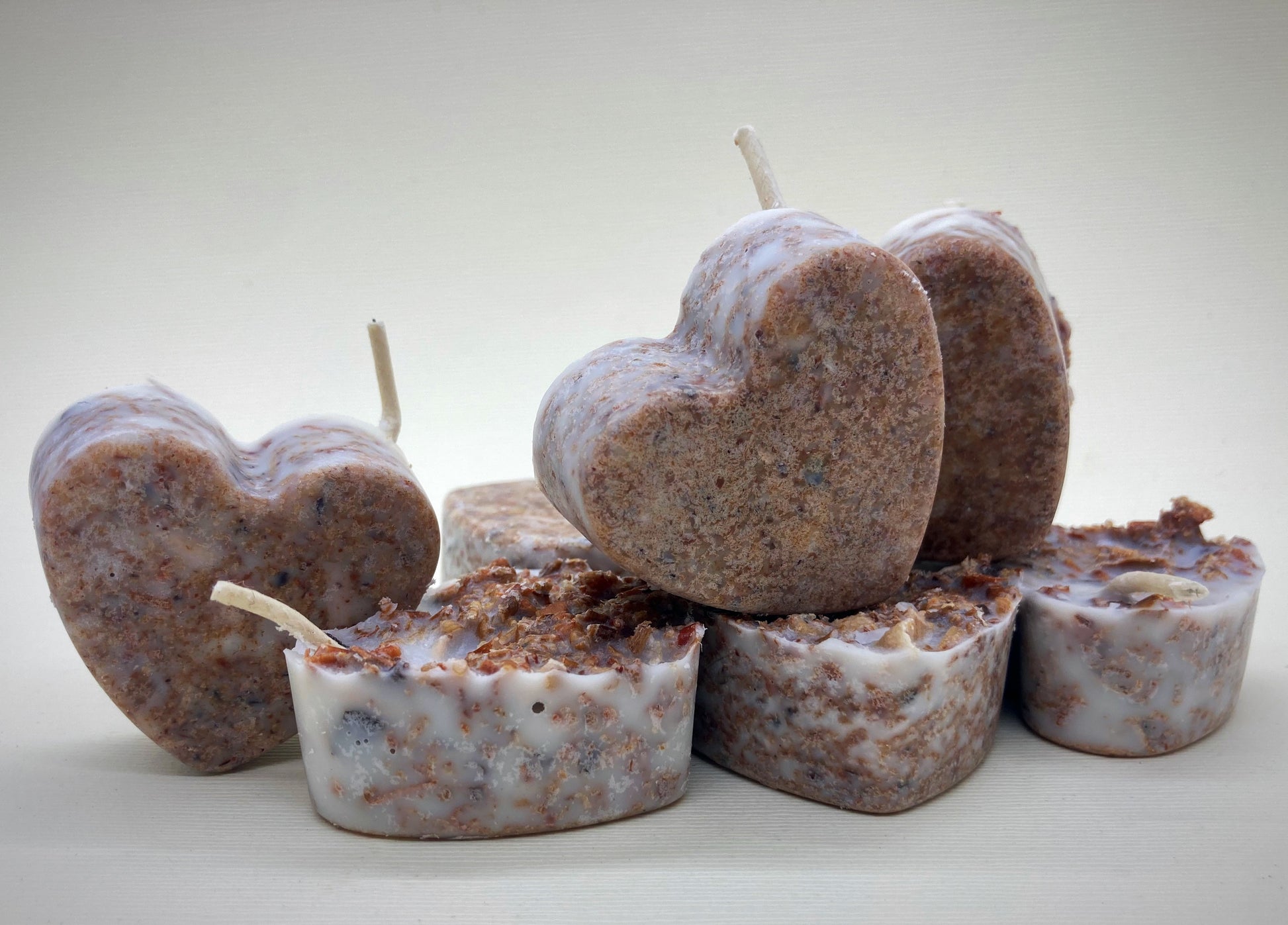 fire starters made from recycled wood shavings wax and essential oil decorated with orange and cinnamon