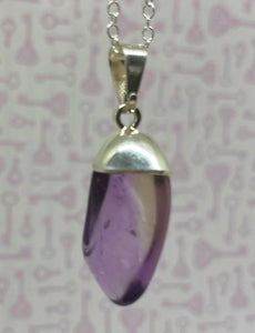 polished amethyst pendant